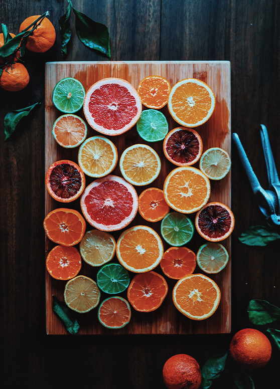 various citrus fruit cut in halves
