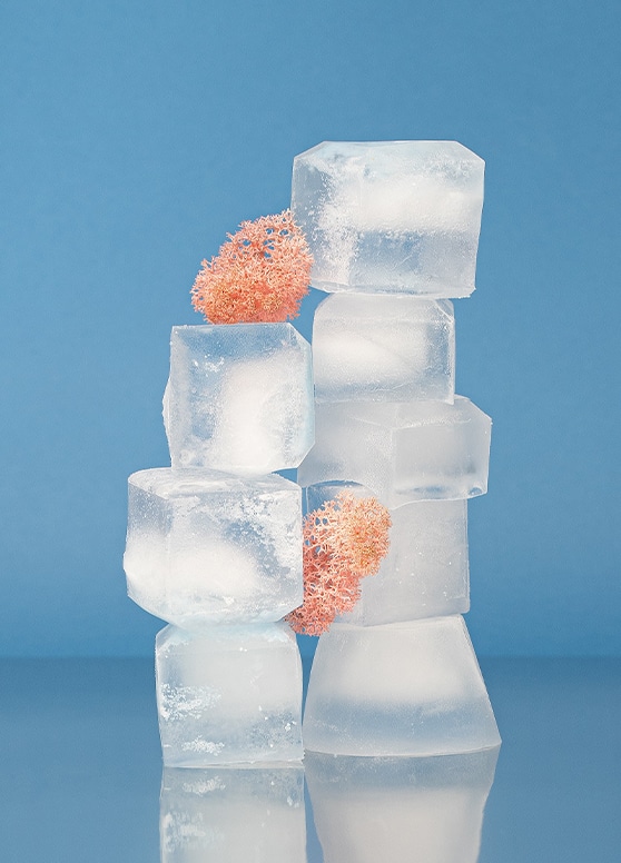 a stack of ice cubes which can be used in a cold compress as a way to tackle a zit